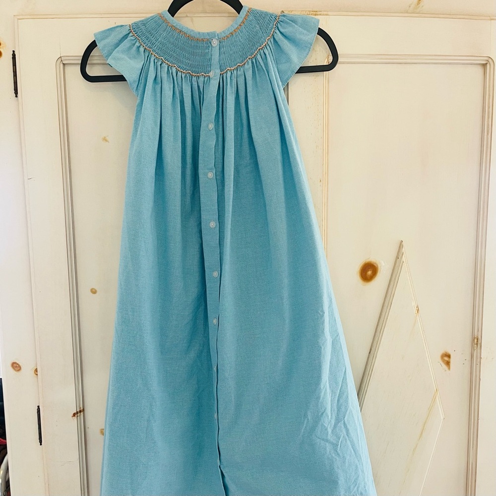 Castles & Crowns Smocked Dress Size 7
w/yellow fish
Aqua Blue Plaid Cap Sleeves - Picture 2 of 7